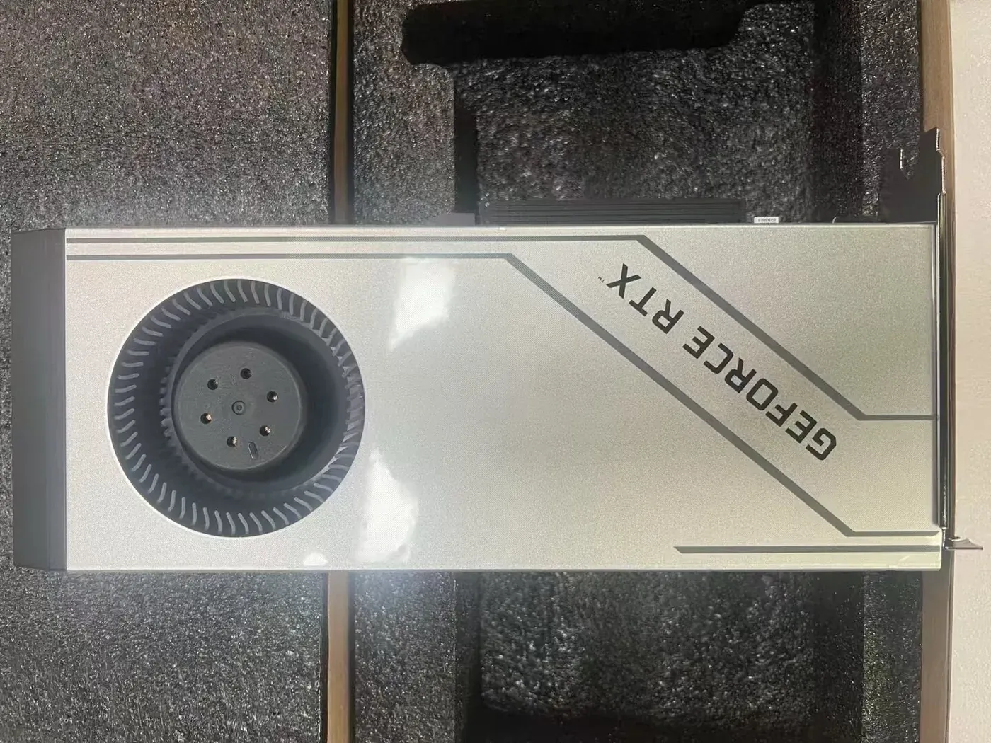Two-slot blower RTX 4090 turbo graphics card in foam packaging from a Shenzhen workshop